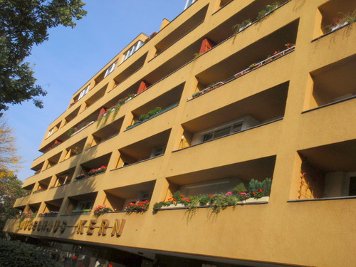 A building proudly display flowering late season blooming plants.